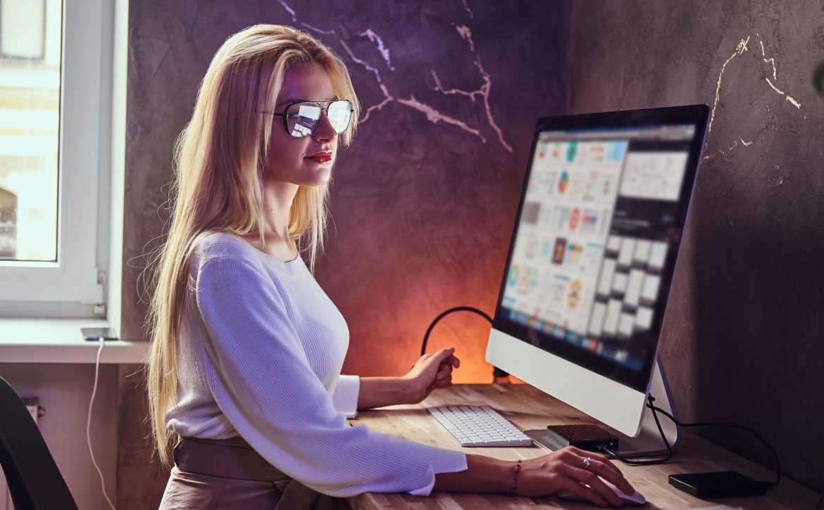 attractive-blond-girl-is-studying-her-modern-room-using-computer