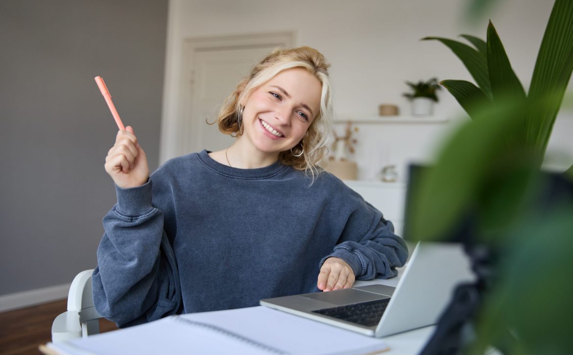 portrait-young-smiling-woman-student-talking-teacher-online-via-video-chat-doing-course-scaled.jpg