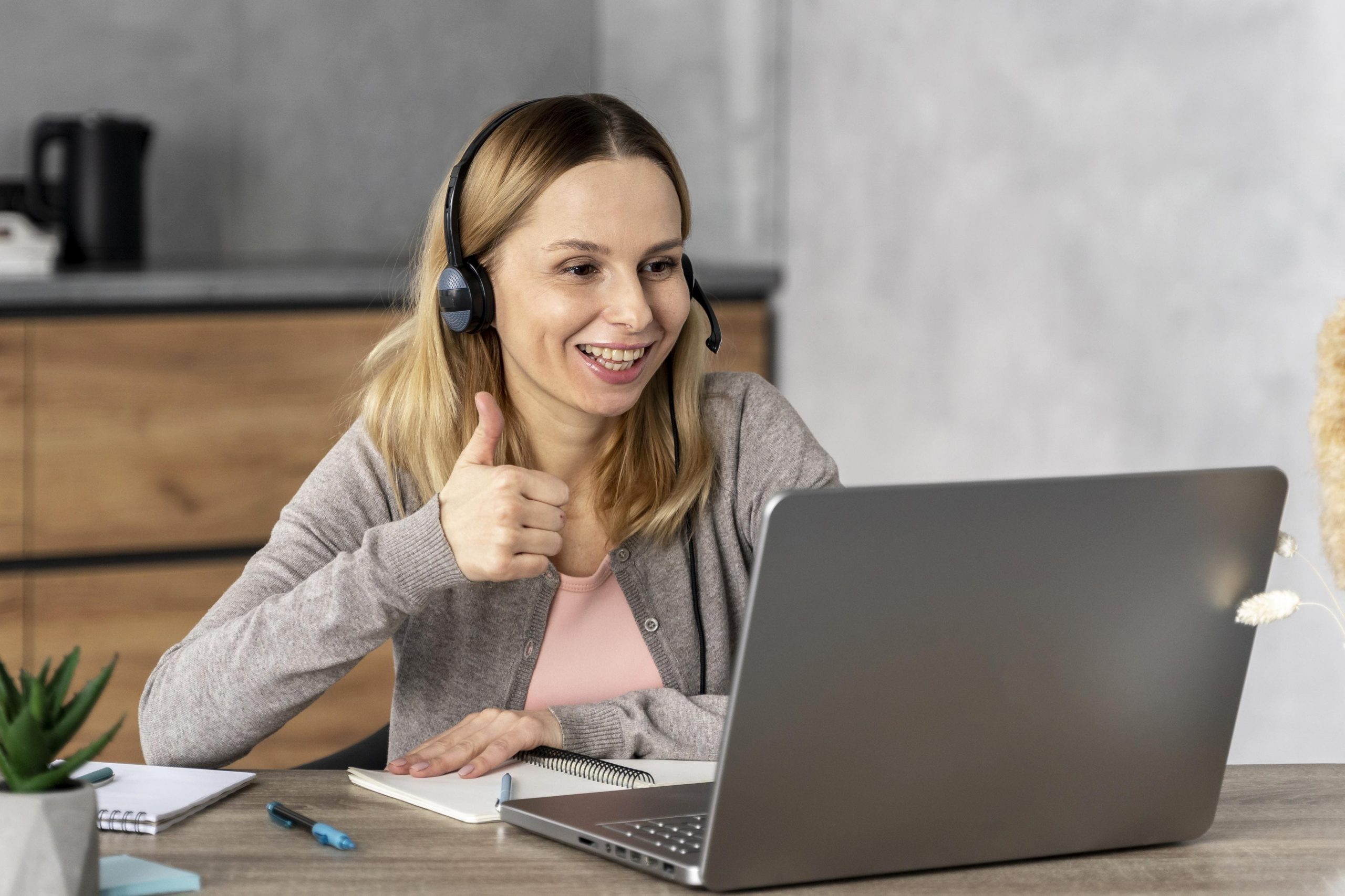 woman-with-headset-working-laptop (1)
